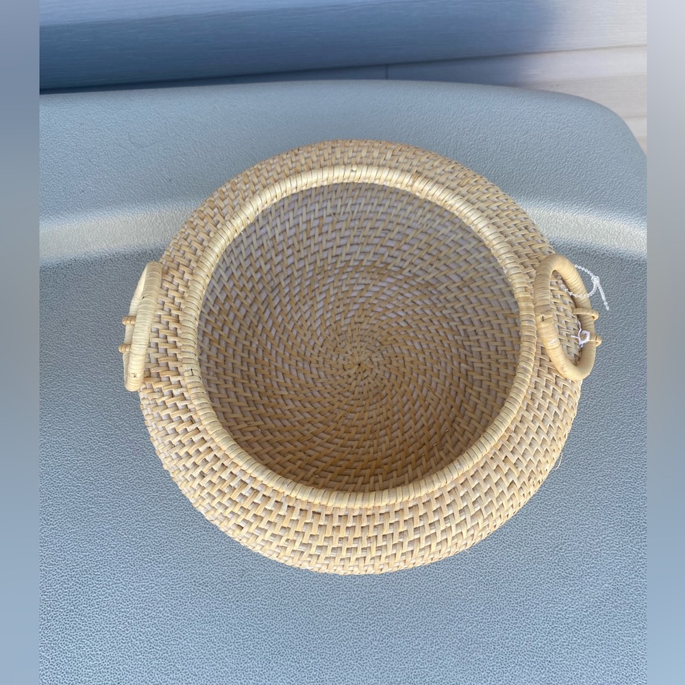 Woven basket with handles on both side. No lid